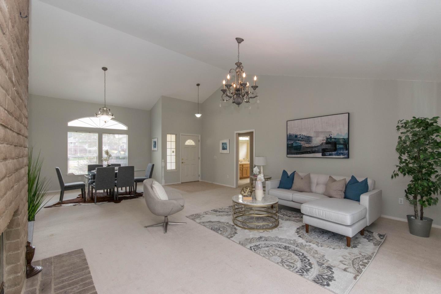 5980 Stone Bridge Road Santa Rosa, CA 95409 - Photo 2 of 24 a living room with furniture and a chandelier