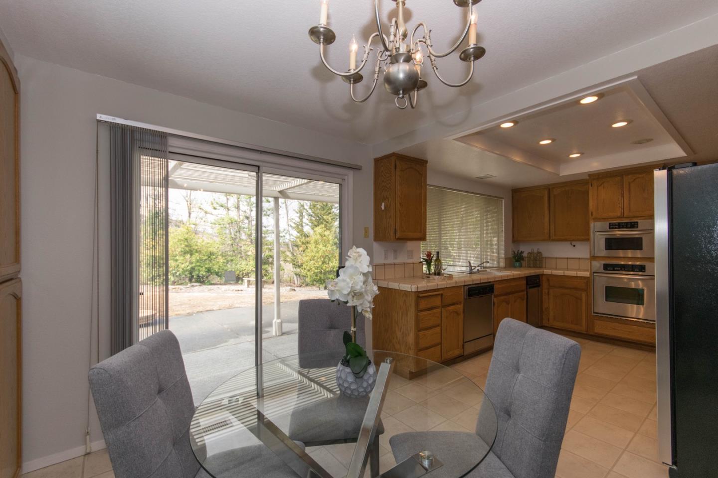 5980 Stone Bridge Road Santa Rosa, CA 95409 - Photo 3 of 24 a view of a dining room with furniture window and outside view