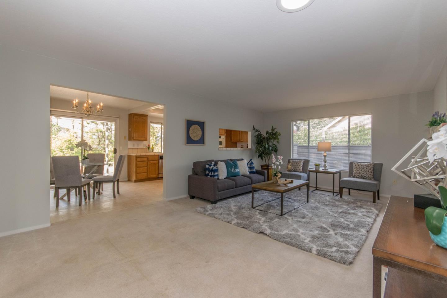 5980 Stone Bridge Road Santa Rosa, CA 95409 - Photo 5 of 24 a living room with furniture and a large window