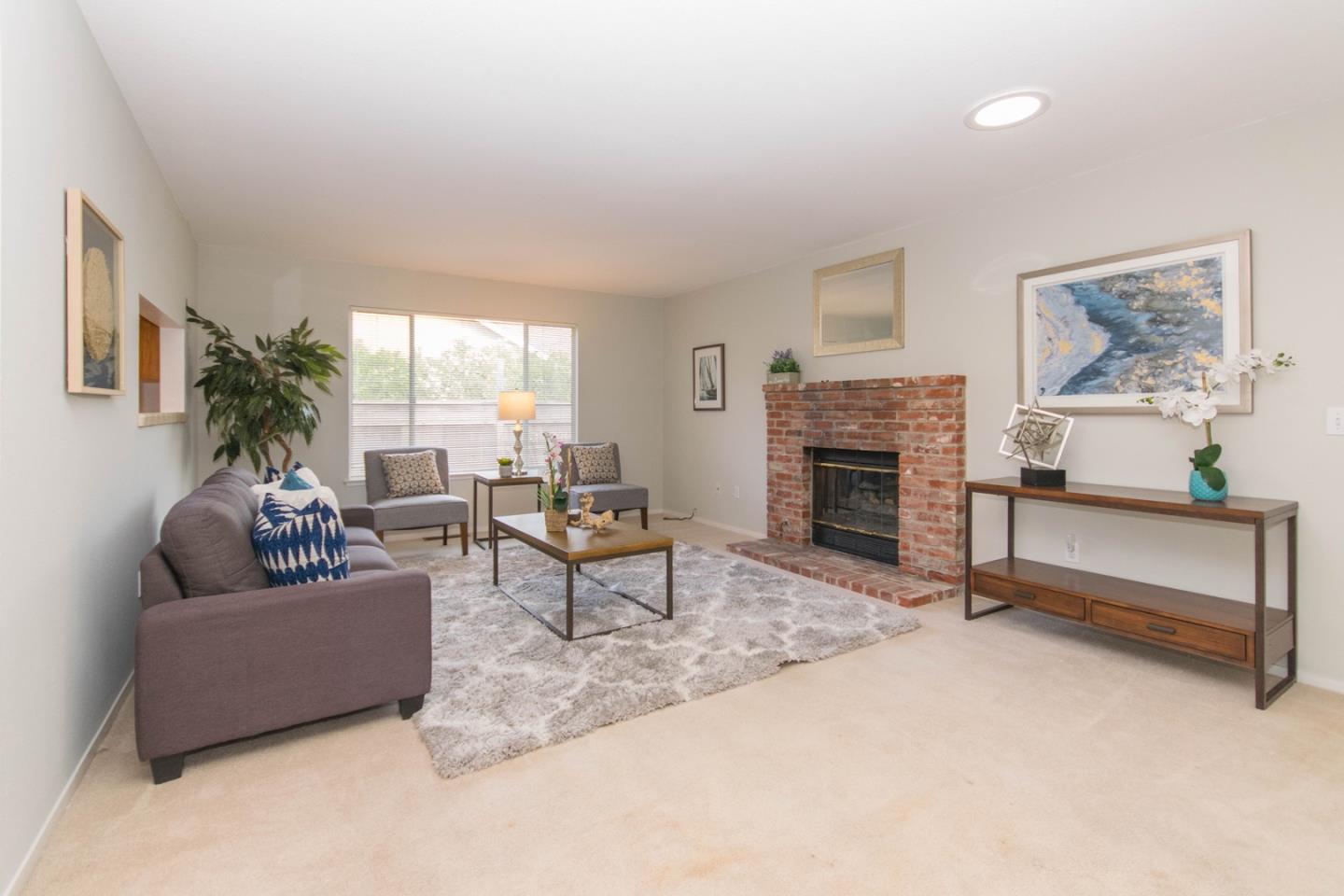 5980 Stone Bridge Road Santa Rosa, CA 95409 - Photo 8 of 24 a living room with furniture and a fireplace