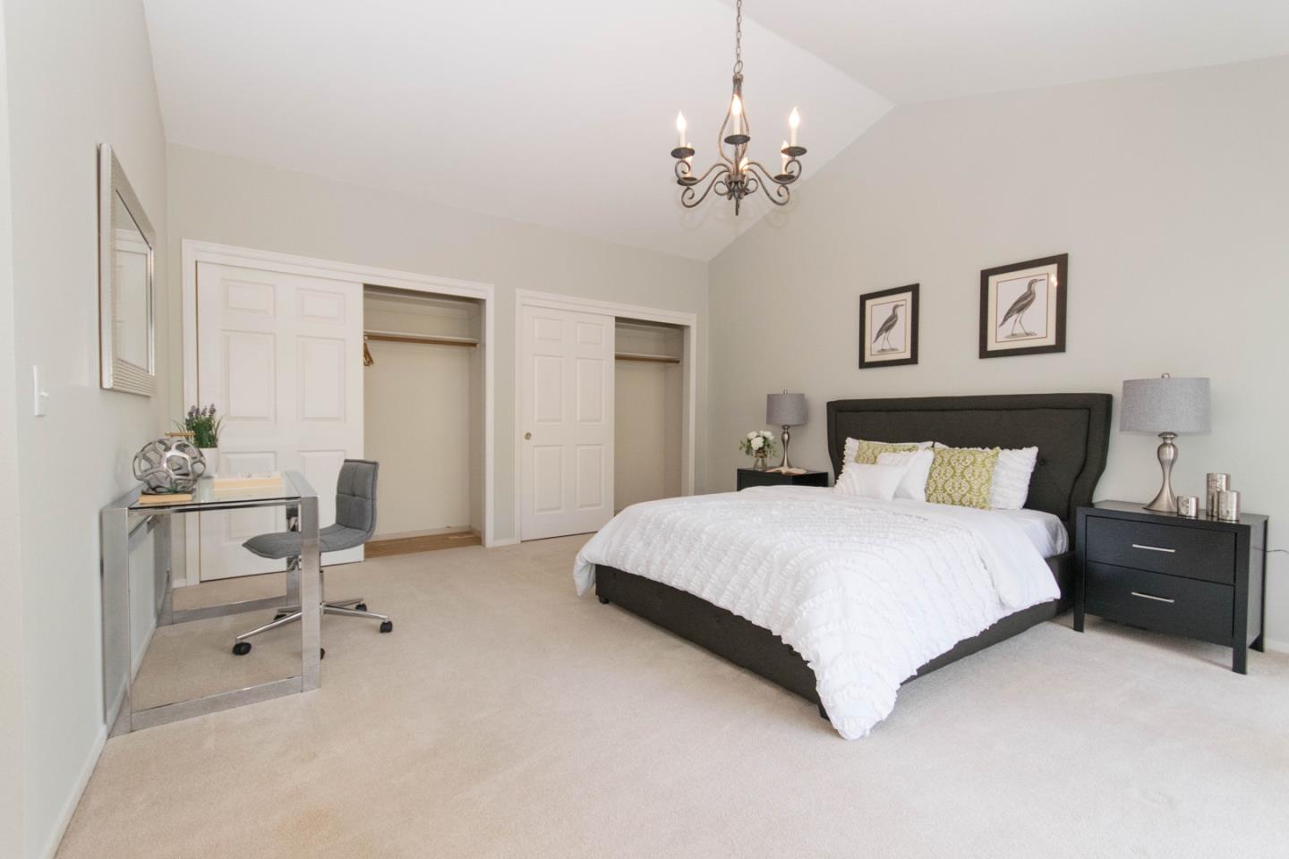 5980 Stone Bridge Road Santa Rosa, CA 95409 - Photo 9 of 24 a bedroom with a bed and a chandelier
