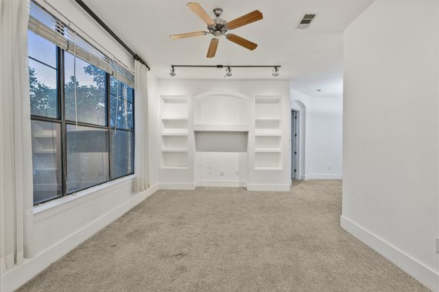 a view of empty room with a door
