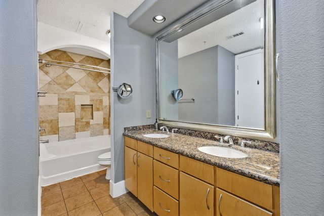 an empty room with a ceiling fan and a window