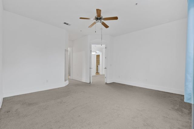 a bathroom with a shower curtain and a sink