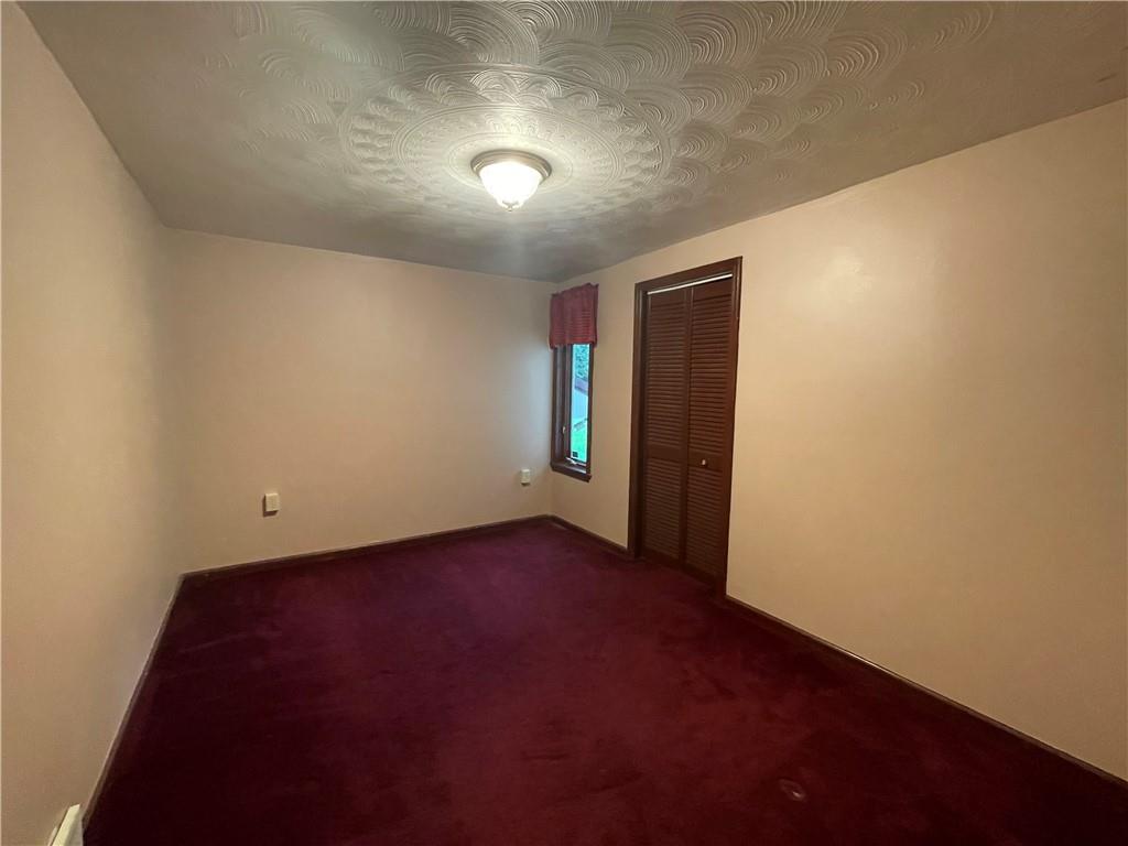 656 Cheese Run Road Indiana, PA 15701 - Photo 10 of 16 an empty room with entrance and windows