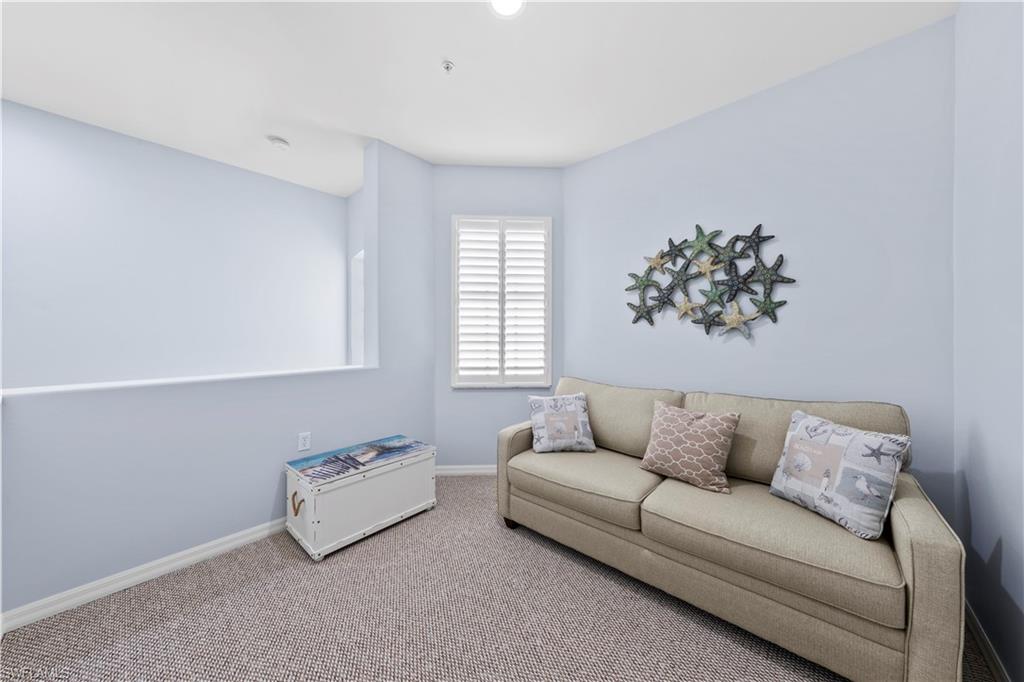 1285 Sweetwater Cove, Unit 2106 Naples, FL 34110 - Photo 19 of 38 a living room with furniture and a couch