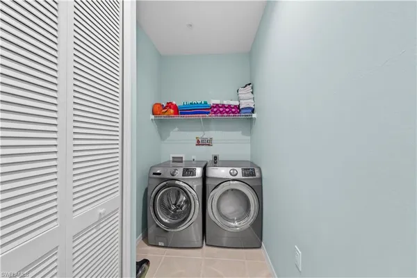 a bedroom with a bed and closet