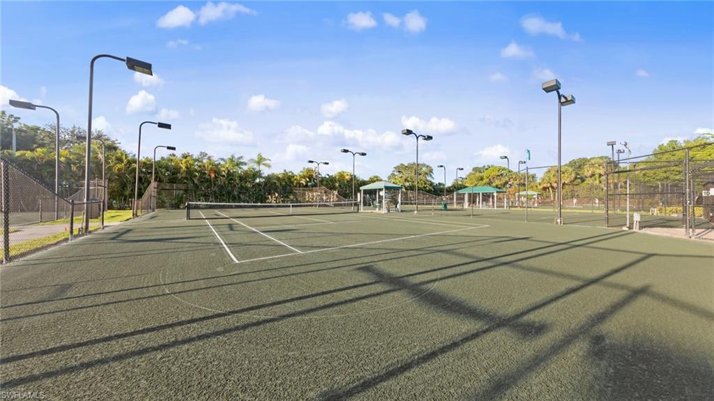 1285 Sweetwater Cove, Unit 2106 Naples, FL 34110 - Photo 26 of 38 a view of a tennis court