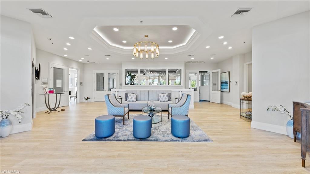 1285 Sweetwater Cove, Unit 2106 Naples, FL 34110 - Photo 28 of 38 a living room with furniture and a table