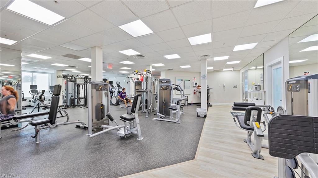 1285 Sweetwater Cove, Unit 2106 Naples, FL 34110 - Photo 30 of 38 a view of a room with gym equipment