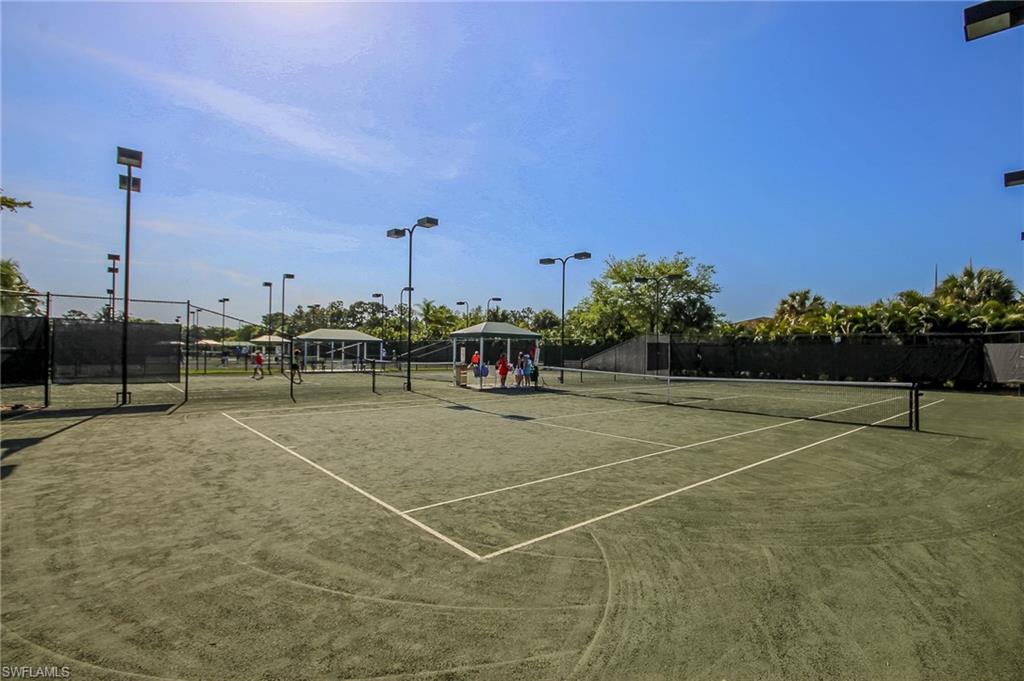 1285 Sweetwater Cove, Unit 2106 Naples, FL 34110 - Photo 32 of 38 a view of a tennis court