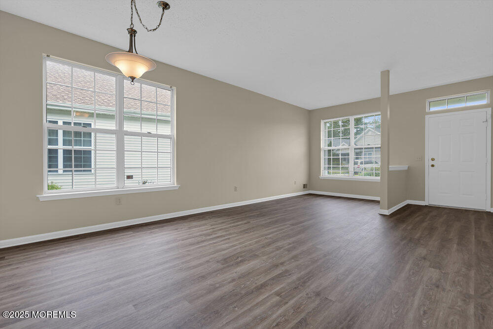 80 Quail Road Barnegat, NJ 08005 - Photo 15 of 27 an empty room with wooden floor and windows