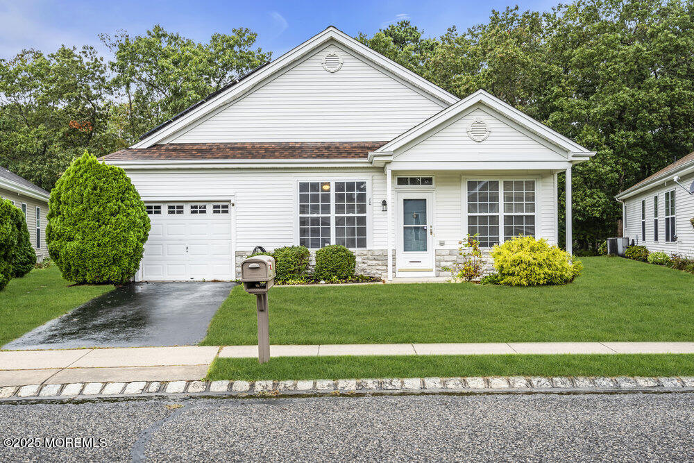 80 Quail Road Barnegat, NJ 08005 - Photo 2 of 27 a front view of a house with a yard and garage