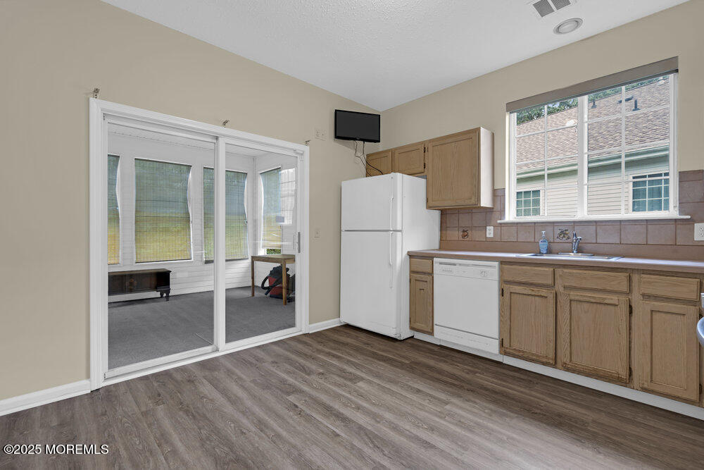 80 Quail Road Barnegat, NJ 08005 - Photo 7 of 27 a kitchen with a refrigerator and a sink