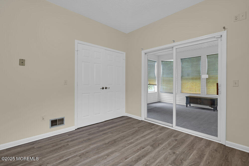 80 Quail Road Barnegat, NJ 08005 - Photo 10 of 27 wooden floor in an empty room with a window