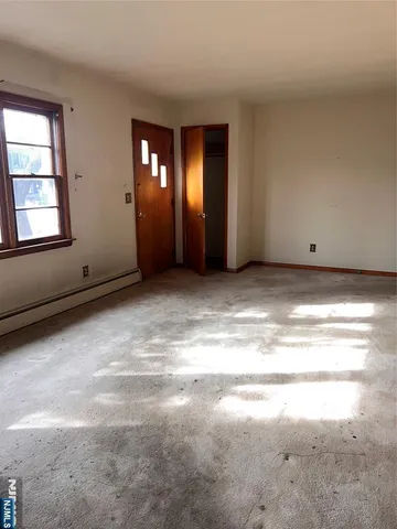 a view of an empty room with window