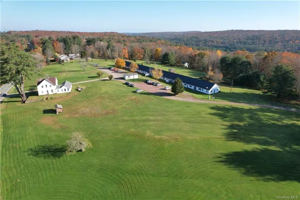 an aerial view of a town with couple of houses