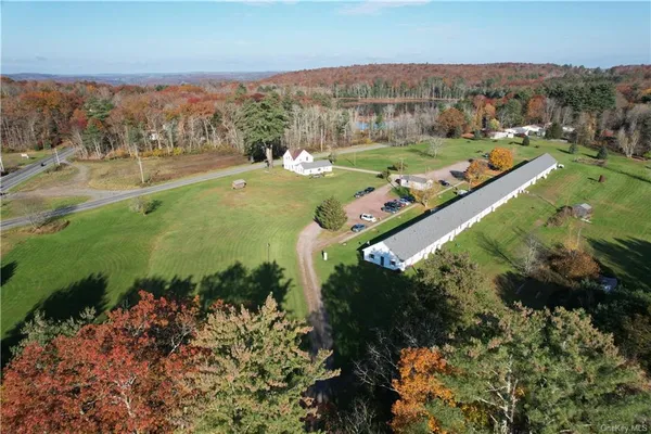 an aerial view of a house with a yard