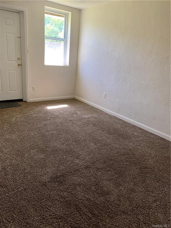22 Arrowhead Apartments Road Narrowsburg, NY 12764 - Photo 24 of 34 an empty room with a window