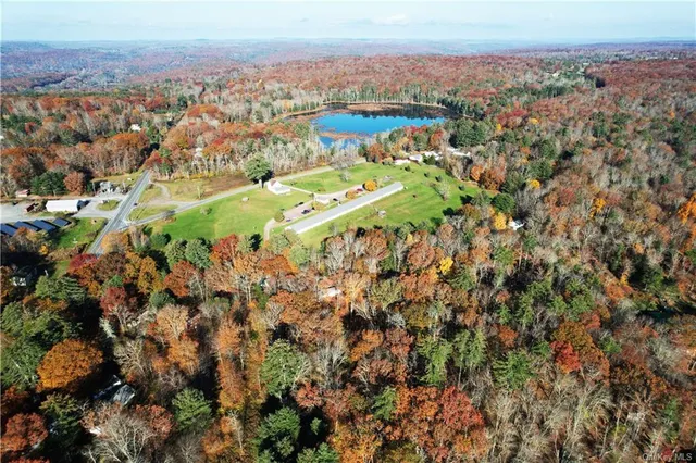 a view of house with garden space and trees