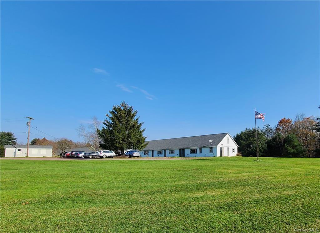 22 Arrowhead Apartments Road Narrowsburg, NY 12764 - Photo 5 of 34 a view of house with garden space and trees