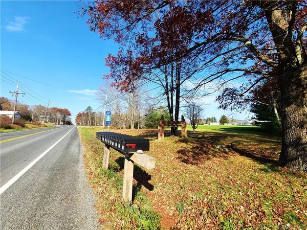 a big house with a big yard and large trees