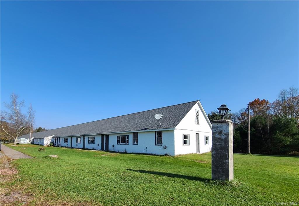 22 Arrowhead Apartments Road Narrowsburg, NY 12764 - Photo 7 of 34 a big house with a big yard and large trees