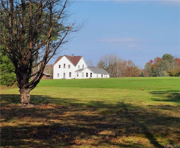 a front view of house with garden