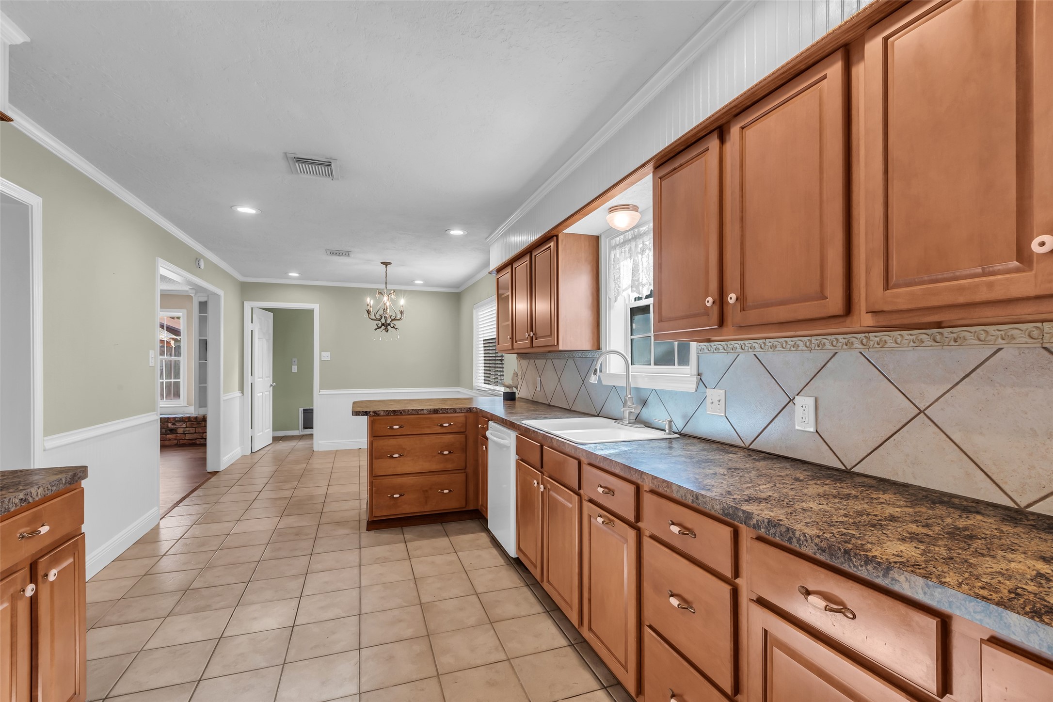 23826 Farm Hill Drive Spring, TX 77373 - Photo 13 of 38 a large kitchen with stainless steel appliances granite countertop a sink and cabinets
