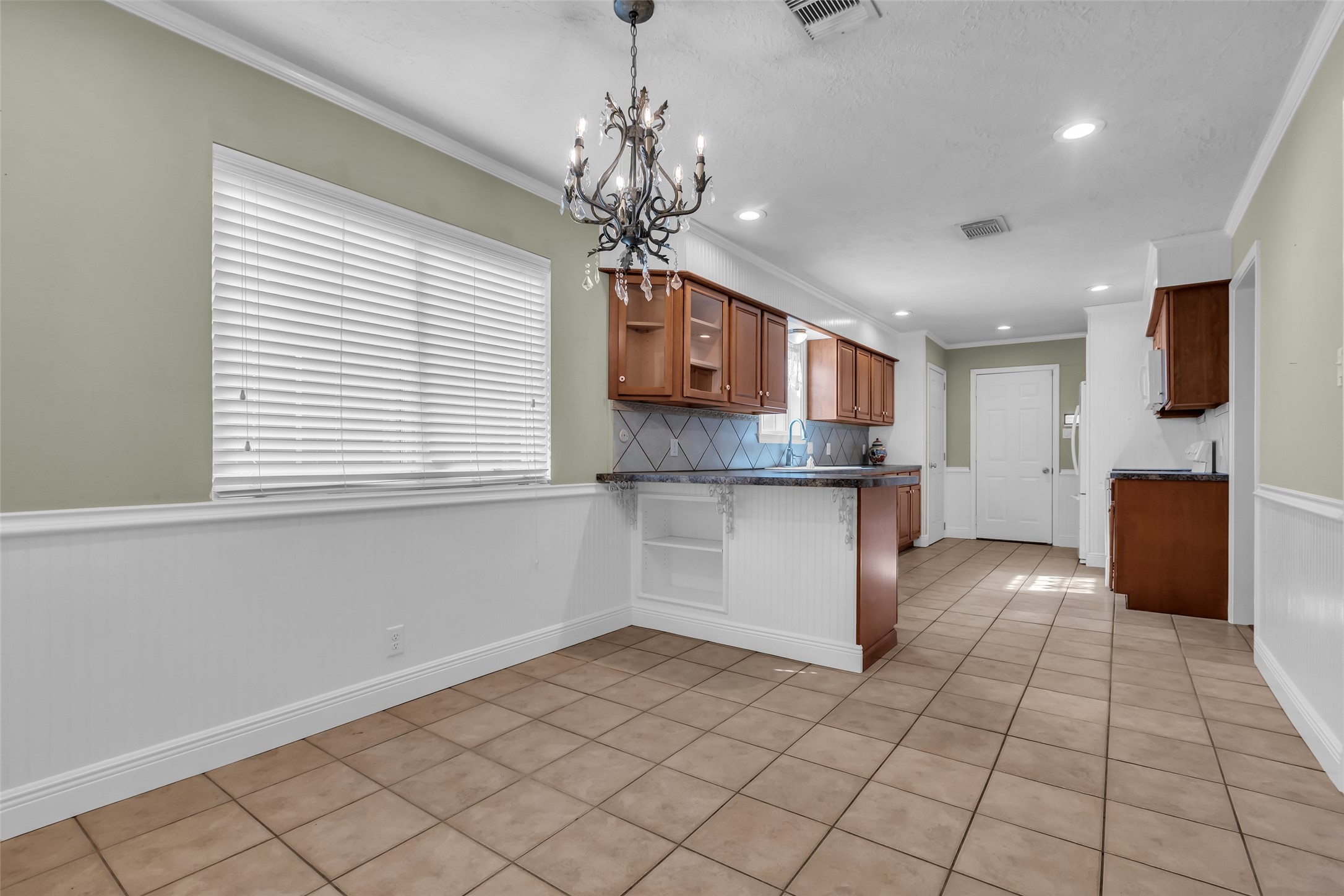 23826 Farm Hill Drive Spring, TX 77373 - Photo 21 of 38 a kitchen with kitchen island granite countertop a stove a sink and a refrigerator