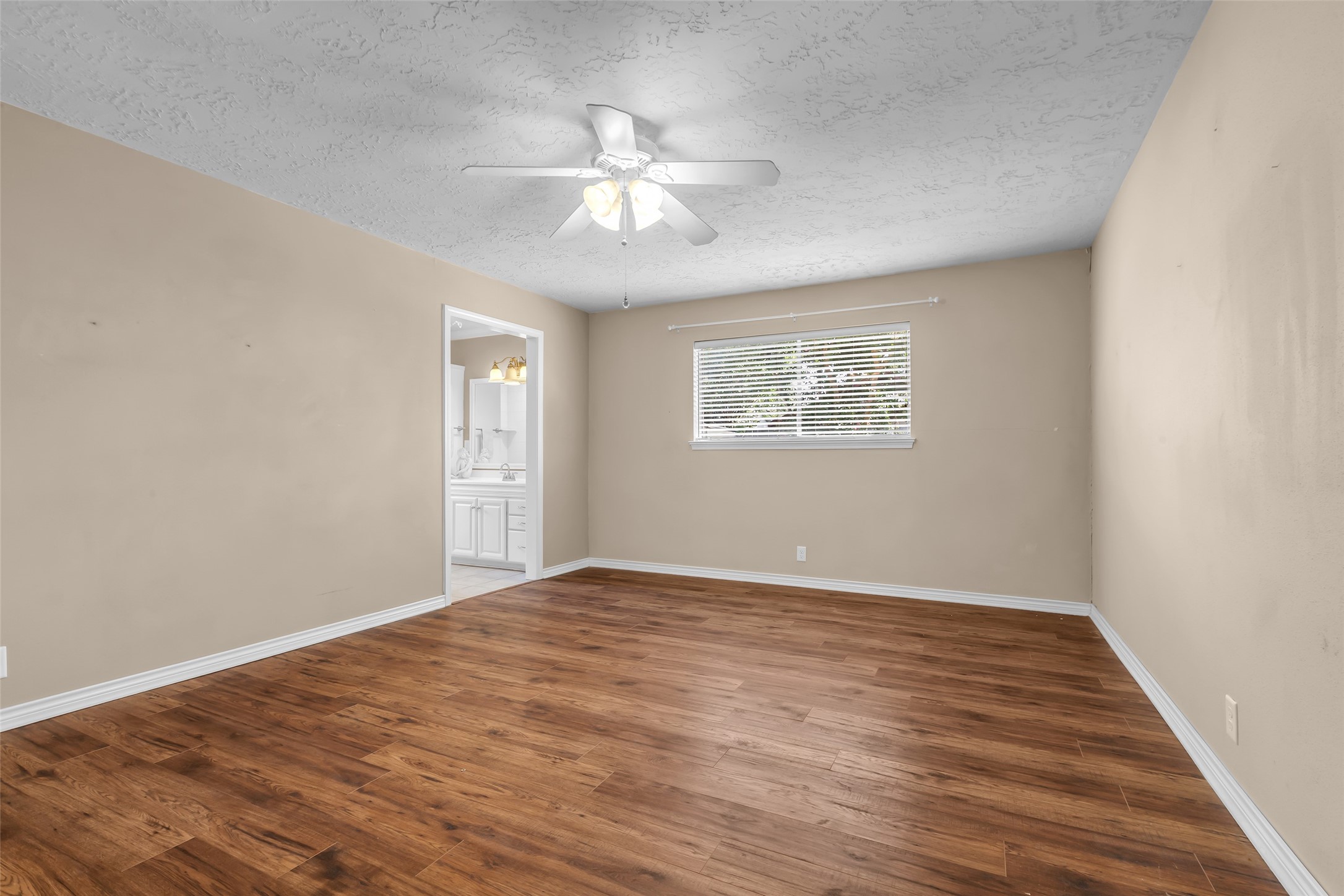 23826 Farm Hill Drive Spring, TX 77373 - Photo 26 of 38 a view of an empty room with wooden floor and a window