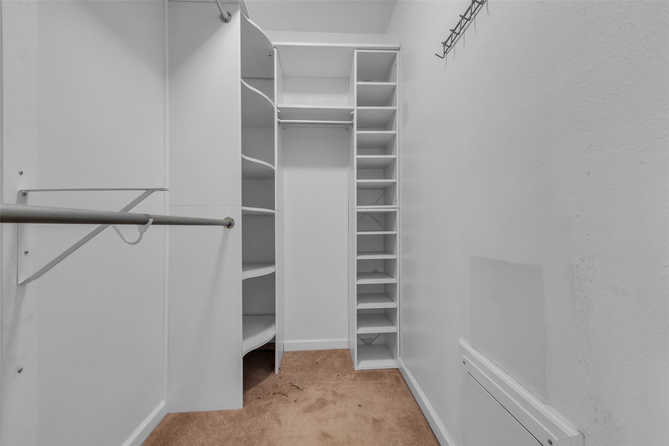 23826 Farm Hill Drive Spring, TX 77373 - Photo 29 of 38 a view of walk in closet with empty racks