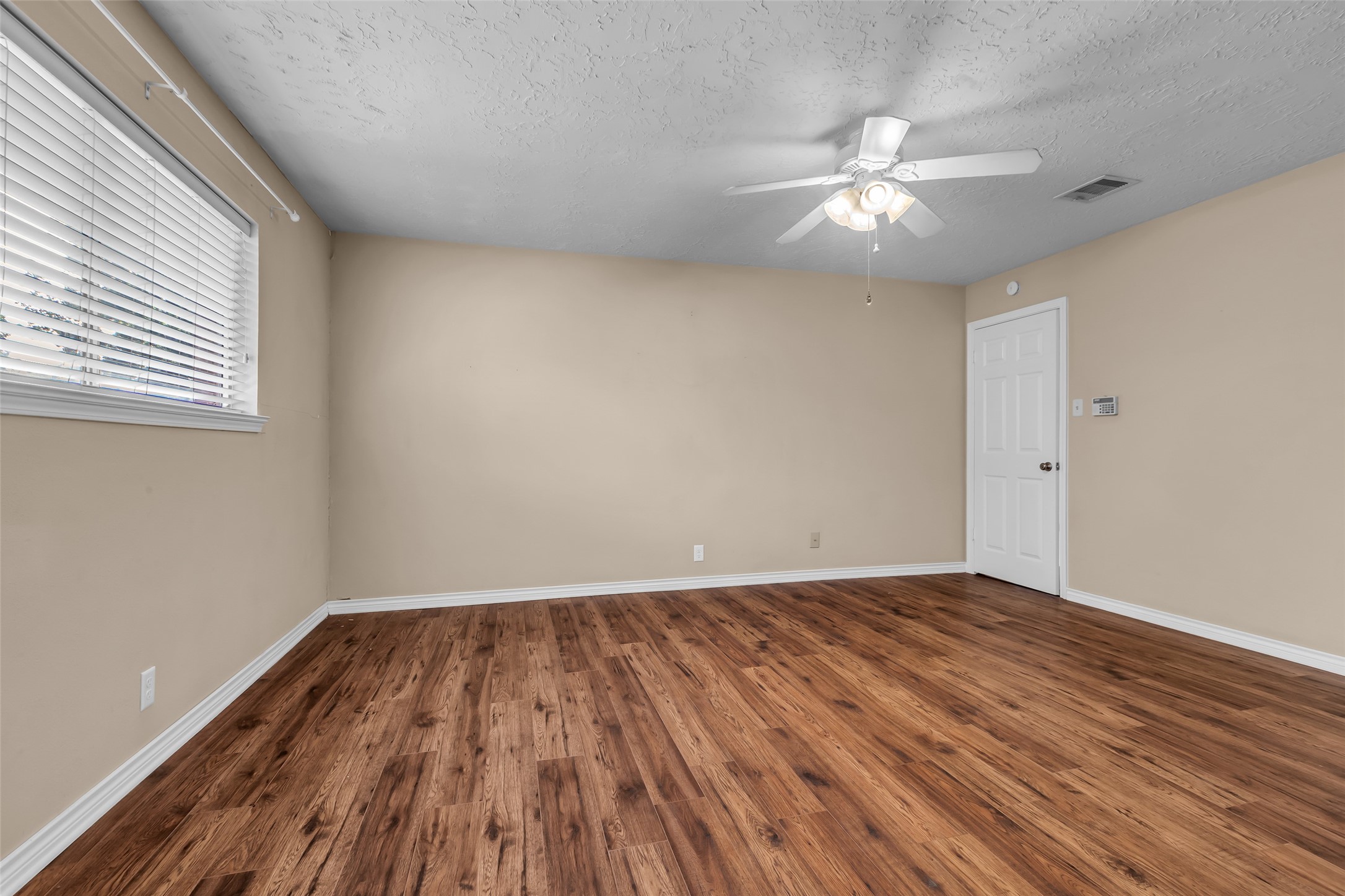 23826 Farm Hill Drive Spring, TX 77373 - Photo 30 of 38 wooden floor in an empty room with a window