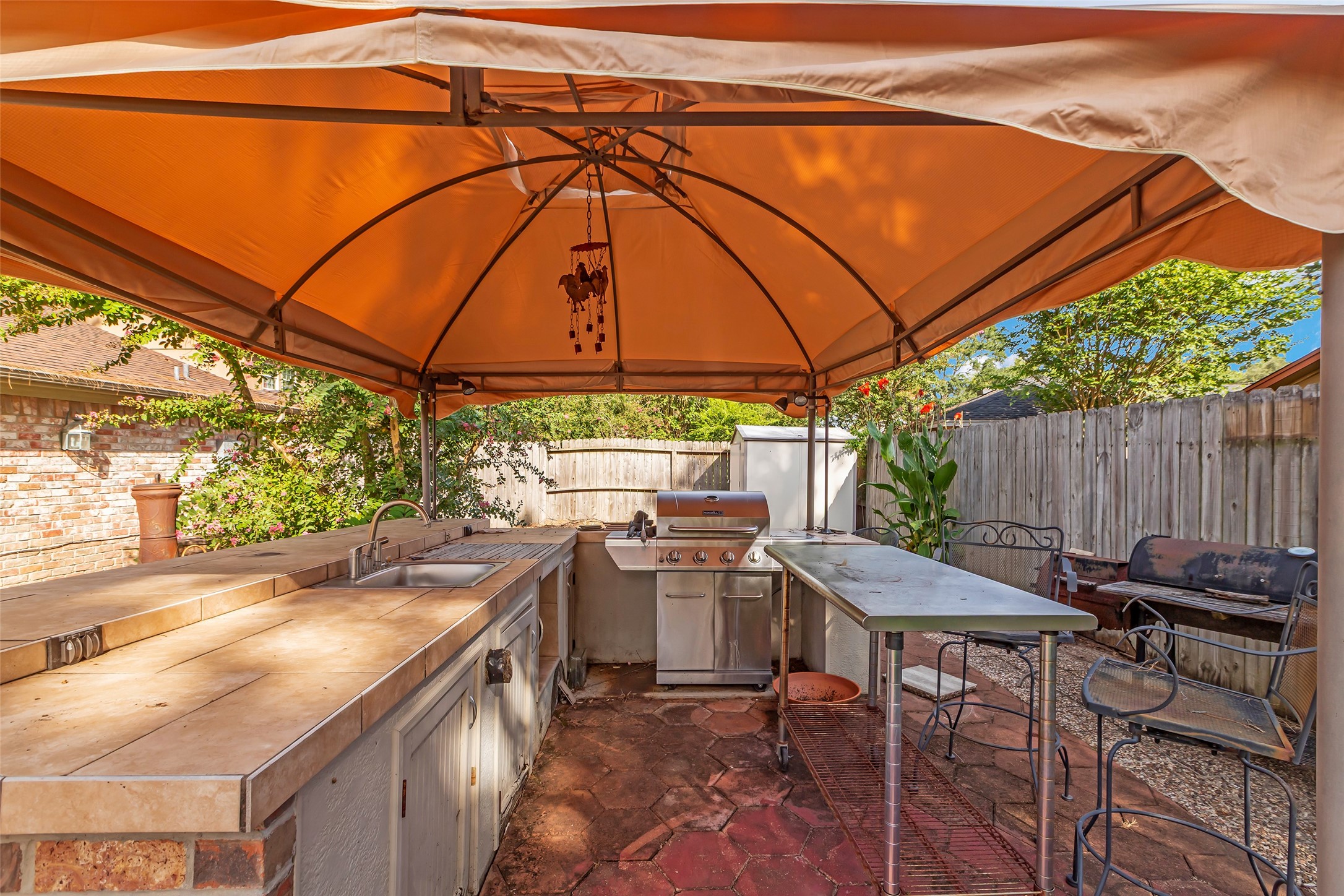 23826 Farm Hill Drive Spring, TX 77373 - Photo 3 of 38 a patio with a table and chairs