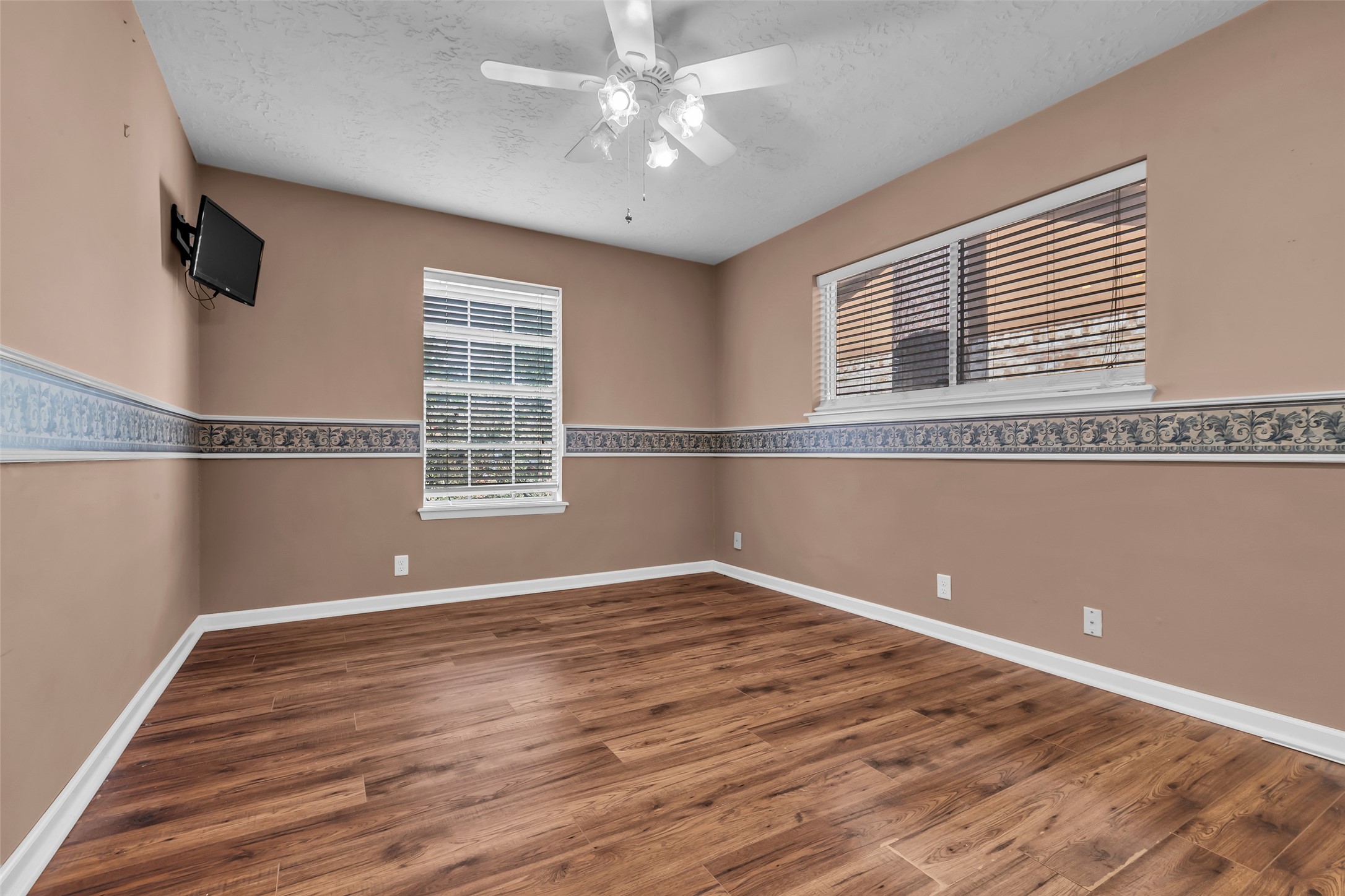 23826 Farm Hill Drive Spring, TX 77373 - Photo 33 of 38 a view of an empty room with wooden floor and a window