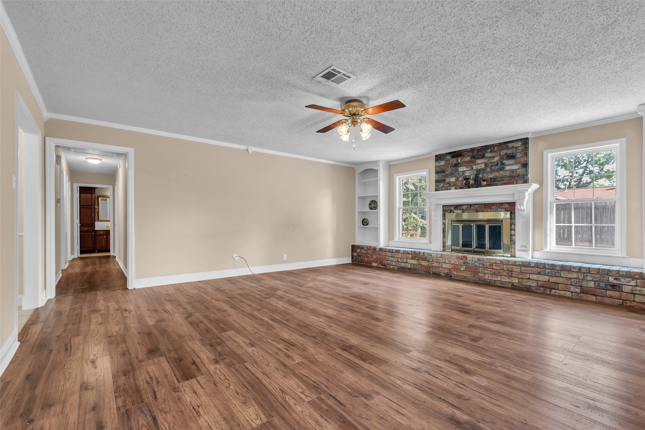 23826 Farm Hill Drive Spring, TX 77373 - Photo 6 of 38 a view of an empty room with window and wooden floor