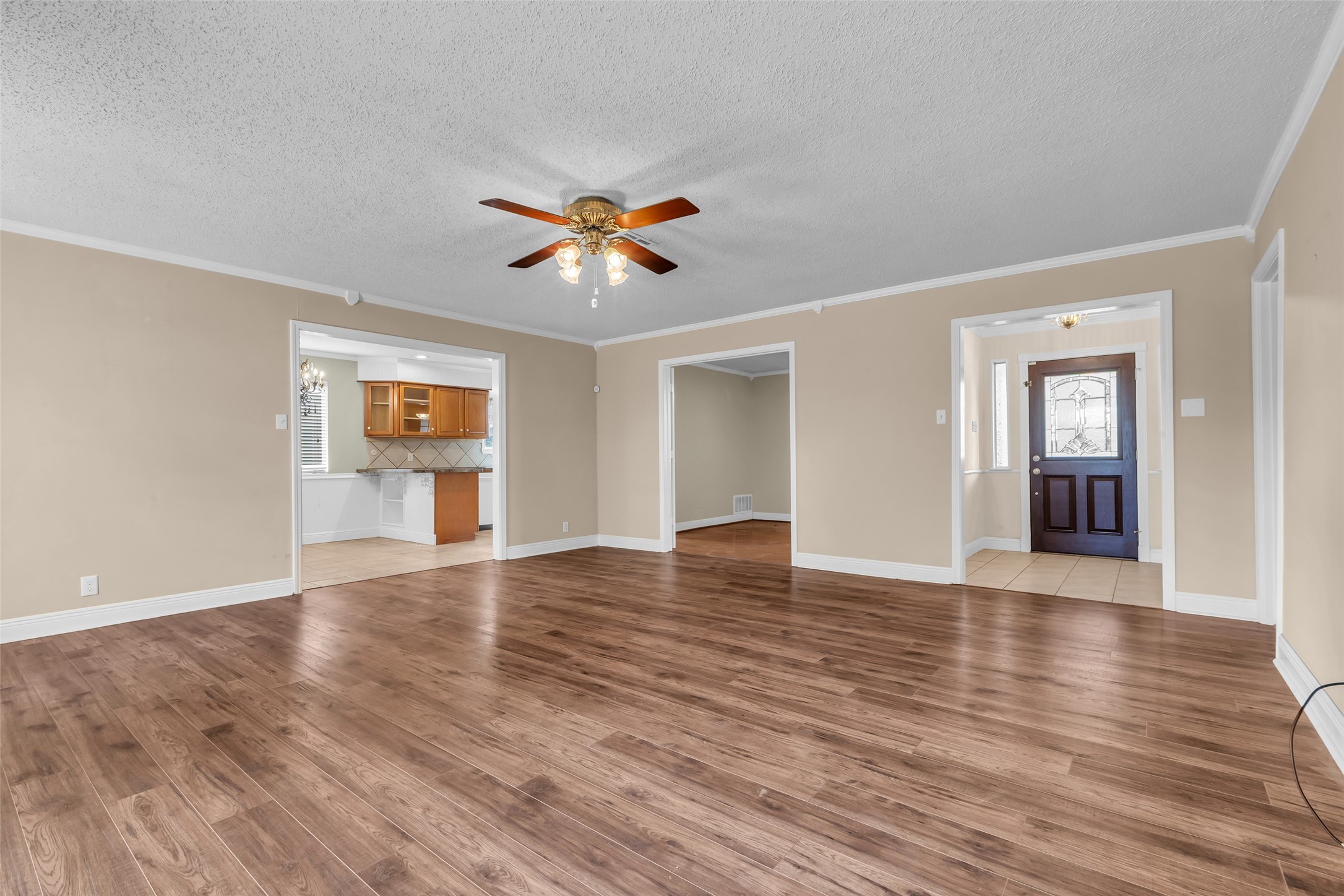 23826 Farm Hill Drive Spring, TX 77373 - Photo 9 of 38 a view of an empty room with window and wooden floor