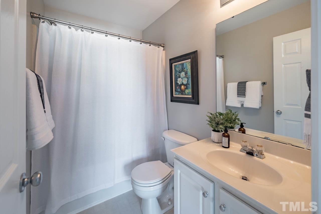 8453 Reedy Ridge Lane Raleigh, NC 27613 - Photo 12 of 21 a bathroom with a sink toilet and shower