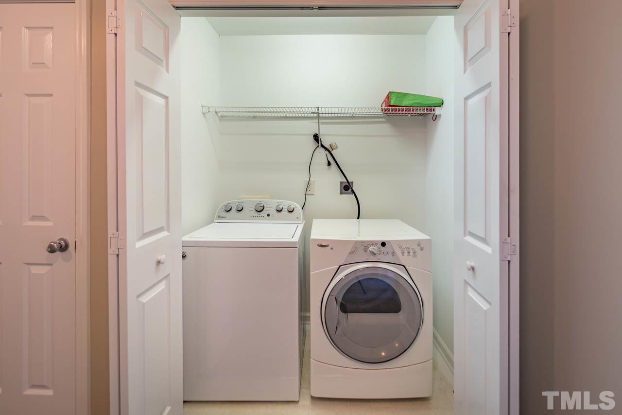 8453 Reedy Ridge Lane Raleigh, NC 27613 - Photo 13 of 21 a utility room with dryer and washer