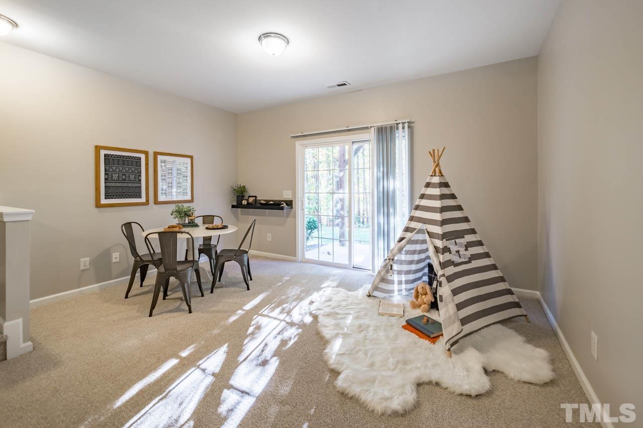 8453 Reedy Ridge Lane Raleigh, NC 27613 - Photo 15 of 21 a dining room with furniture and wooden floor