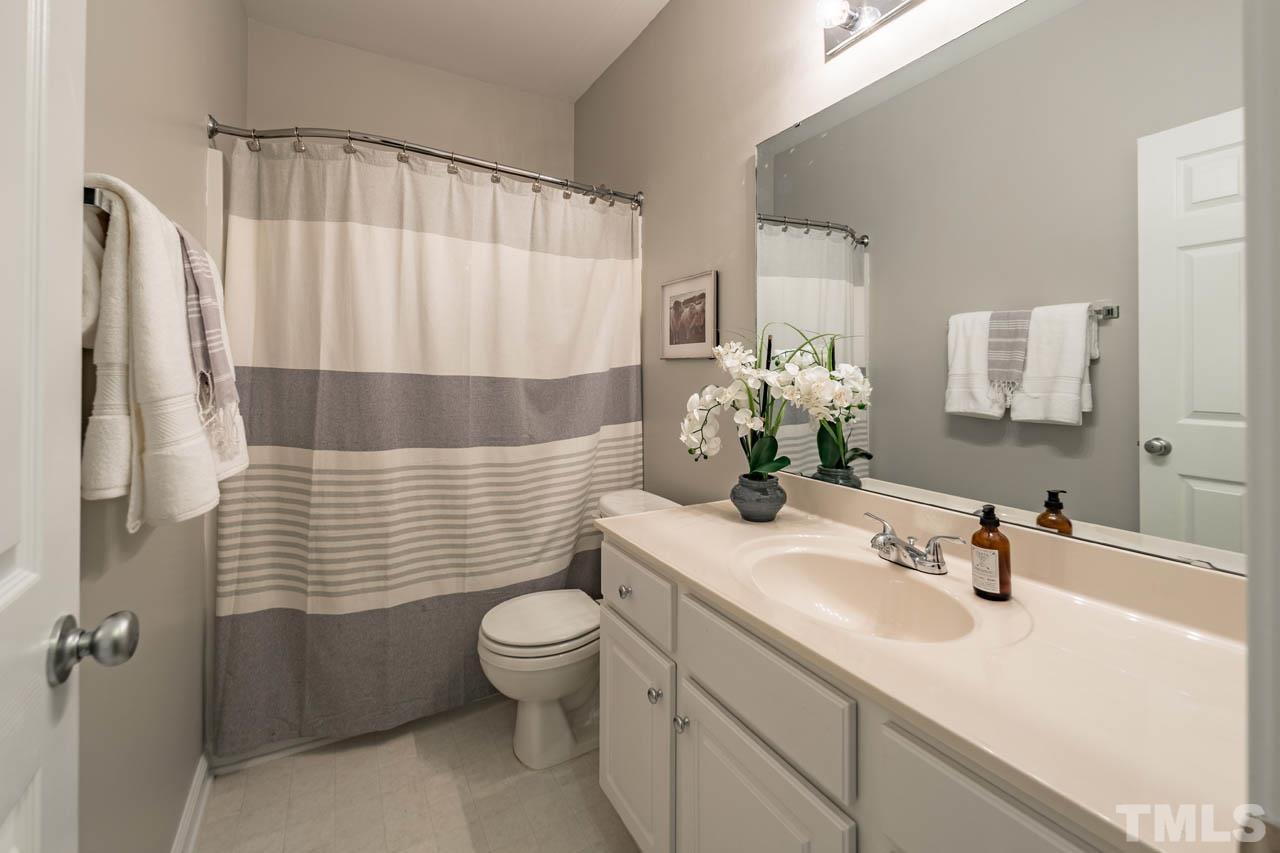 8453 Reedy Ridge Lane Raleigh, NC 27613 - Photo 17 of 21 a bathroom with a sink toilet and shower
