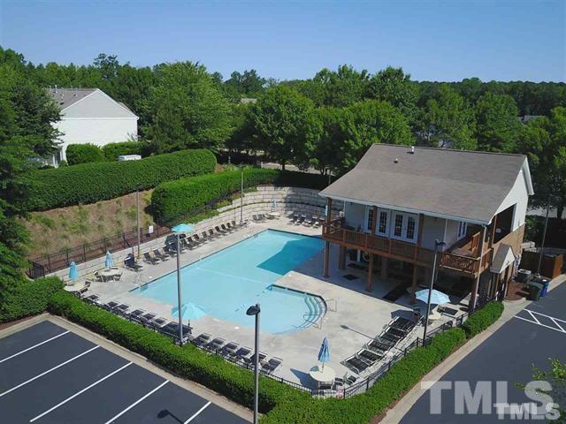 8453 Reedy Ridge Lane Raleigh, NC 27613 - Photo 21 of 21 a view of a house with pool and a yard