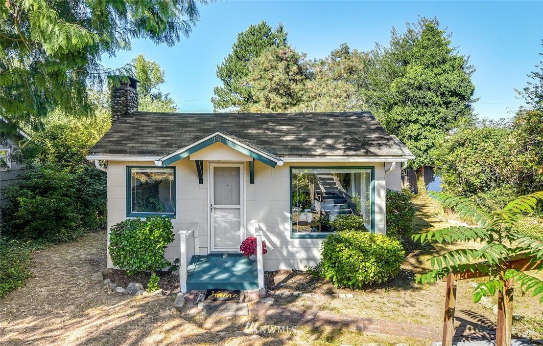 7511 14th Avenue Southwest Seattle, WA 98106 - Photo 14 of 16 a front view of a house with garden