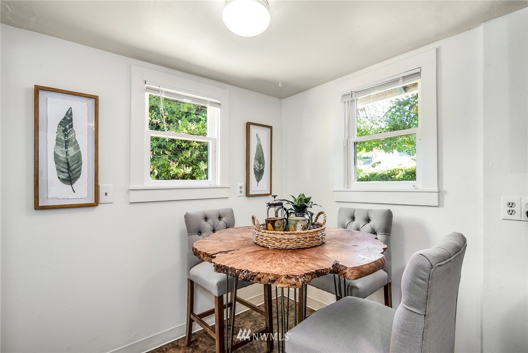 7511 14th Avenue Southwest Seattle, WA 98106 - Photo 6 of 16 a dining room with furniture and window