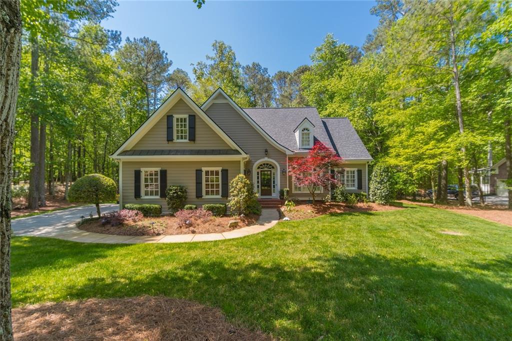 2125 Country Ridge Road Milton, GA 30004 - Photo 1 of 1 a front view of house with yard outdoor seating and green space