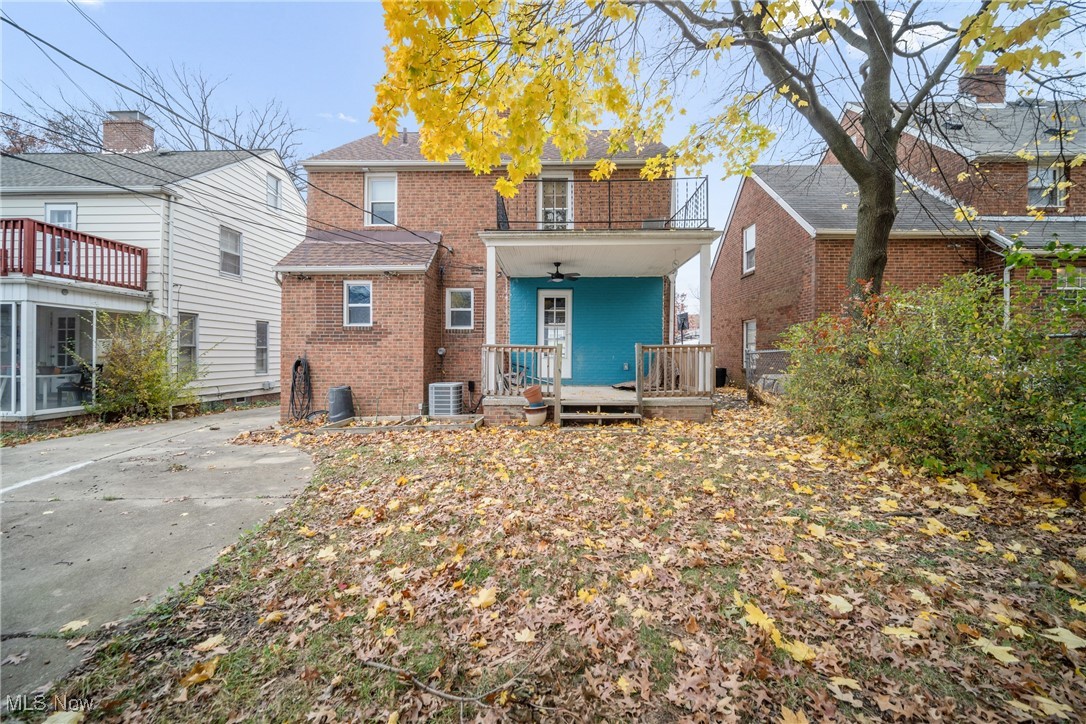 4430 Silsby Road Cleveland, OH 44118 - Photo 5 of 43 Rear view of house with ceiling fan, a porch, a balcony, and central AC