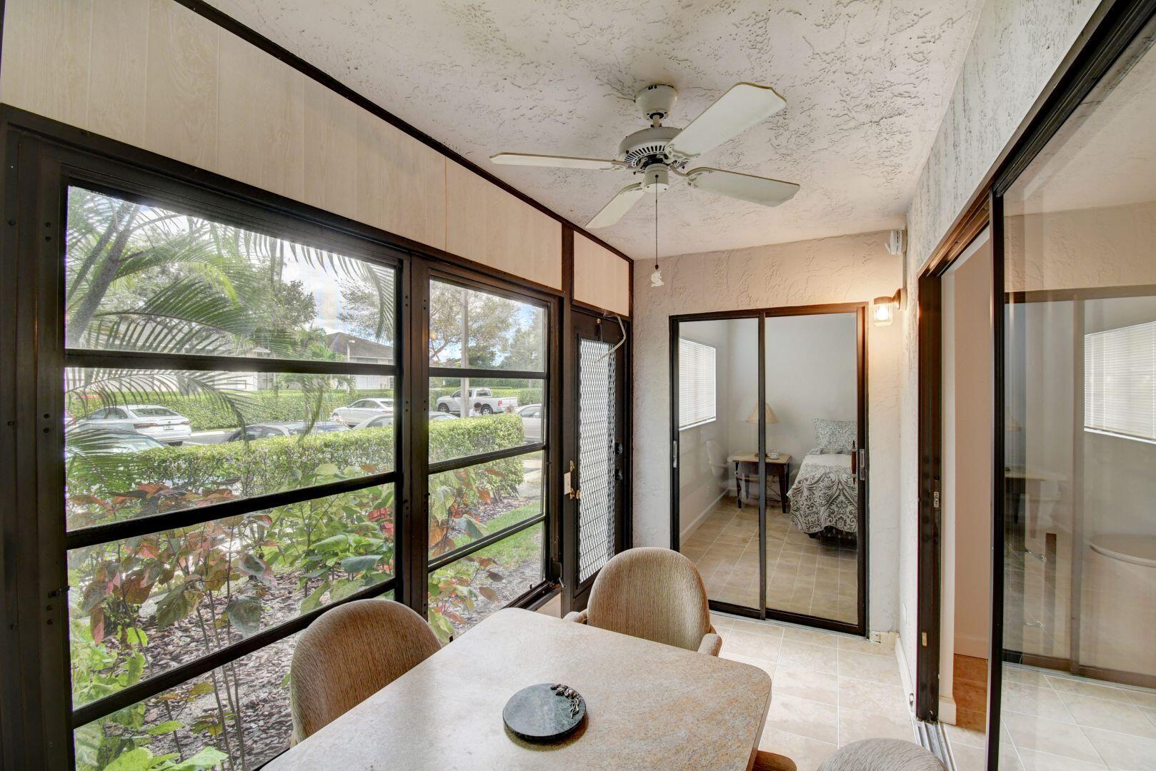 15364 Lakes Of Delray Boulevard, Unit 45 Delray Beach, FL 33484 - Photo 13 of 56 a view of living room with furniture and a large window