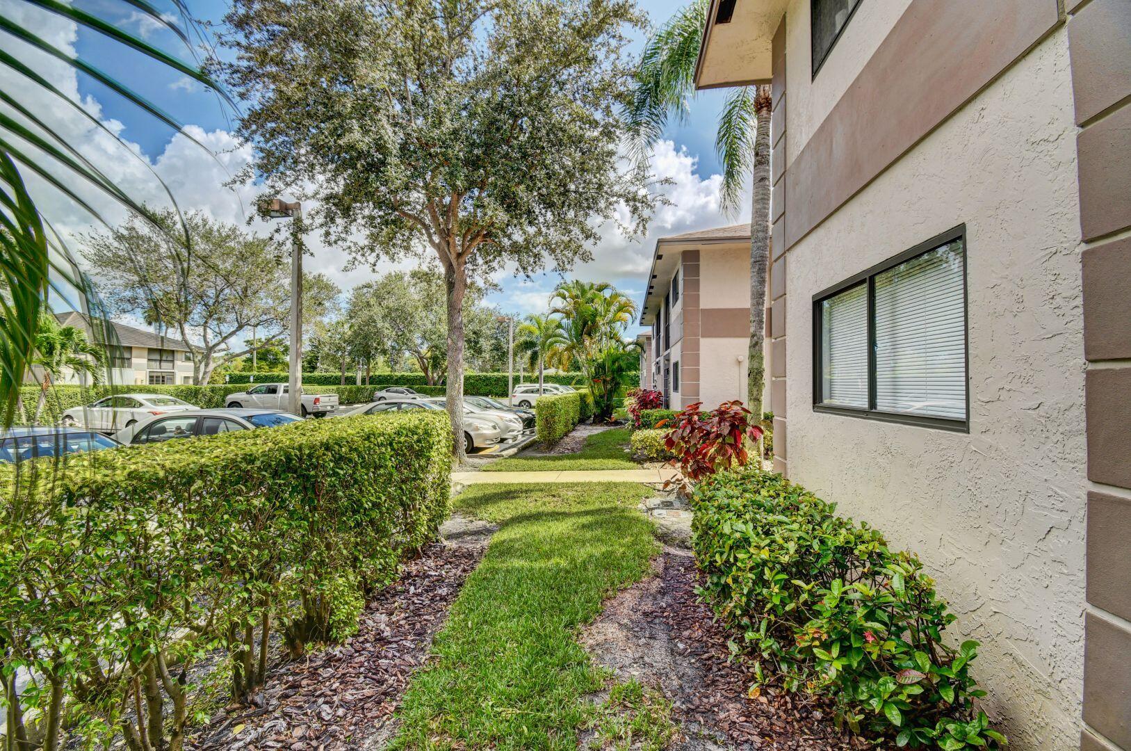 15364 Lakes Of Delray Boulevard, Unit 45 Delray Beach, FL 33484 - Photo 15 of 56 a view of a house with garden and sitting area