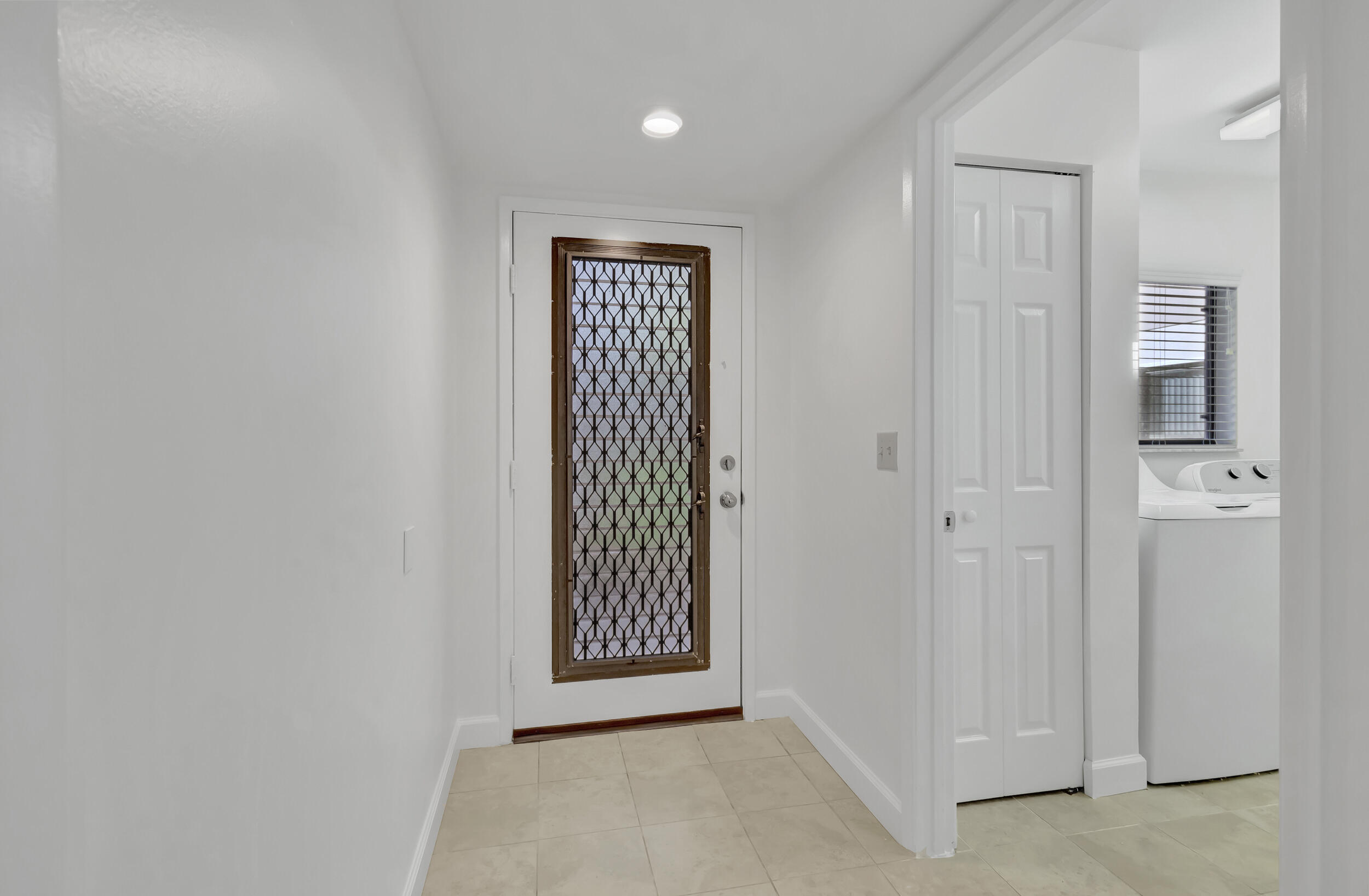 15364 Lakes Of Delray Boulevard, Unit 45 Delray Beach, FL 33484 - Photo 16 of 56 an empty room with windows