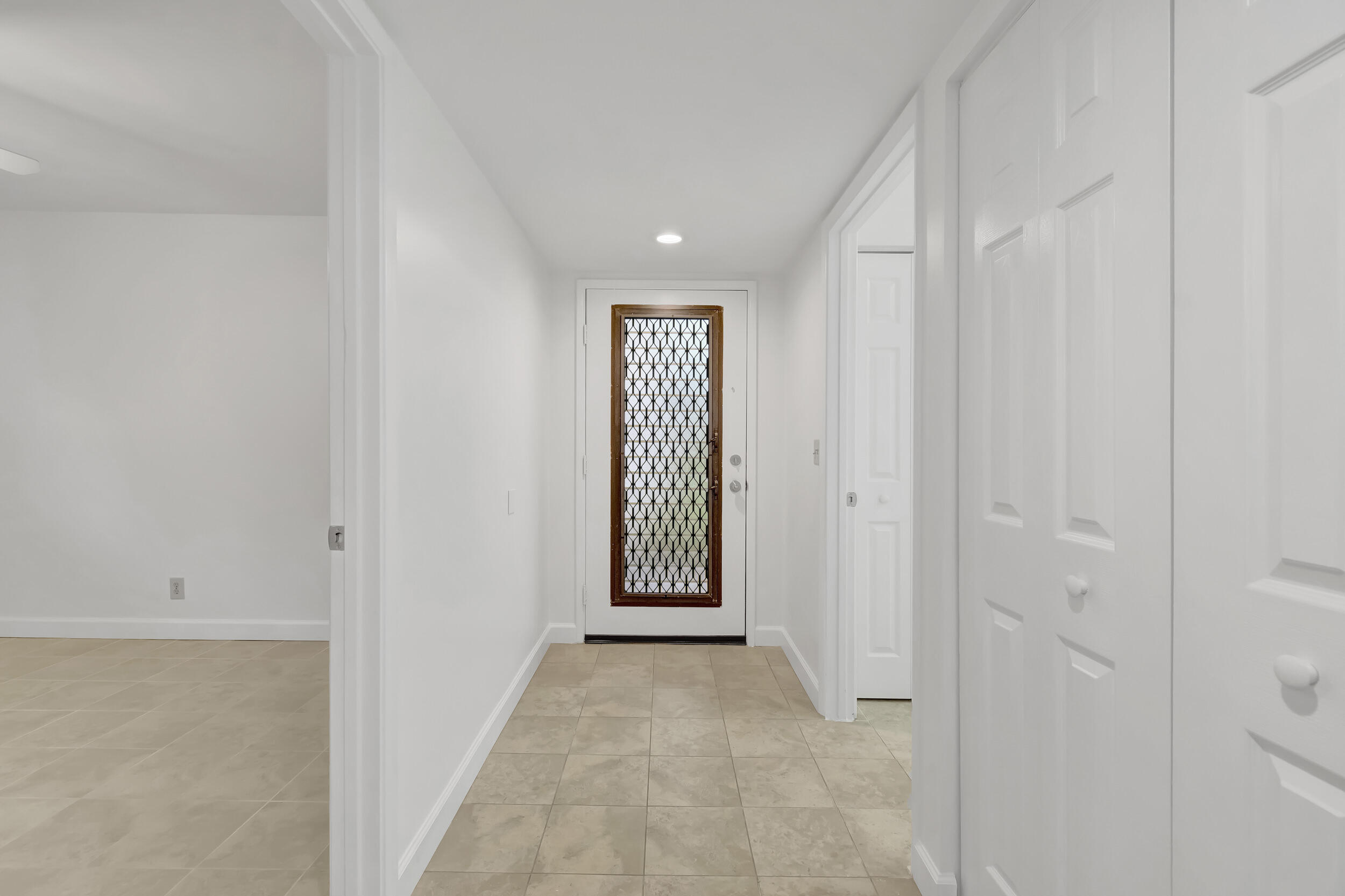15364 Lakes Of Delray Boulevard, Unit 45 Delray Beach, FL 33484 - Photo 17 of 56 a view of a hallway with front door